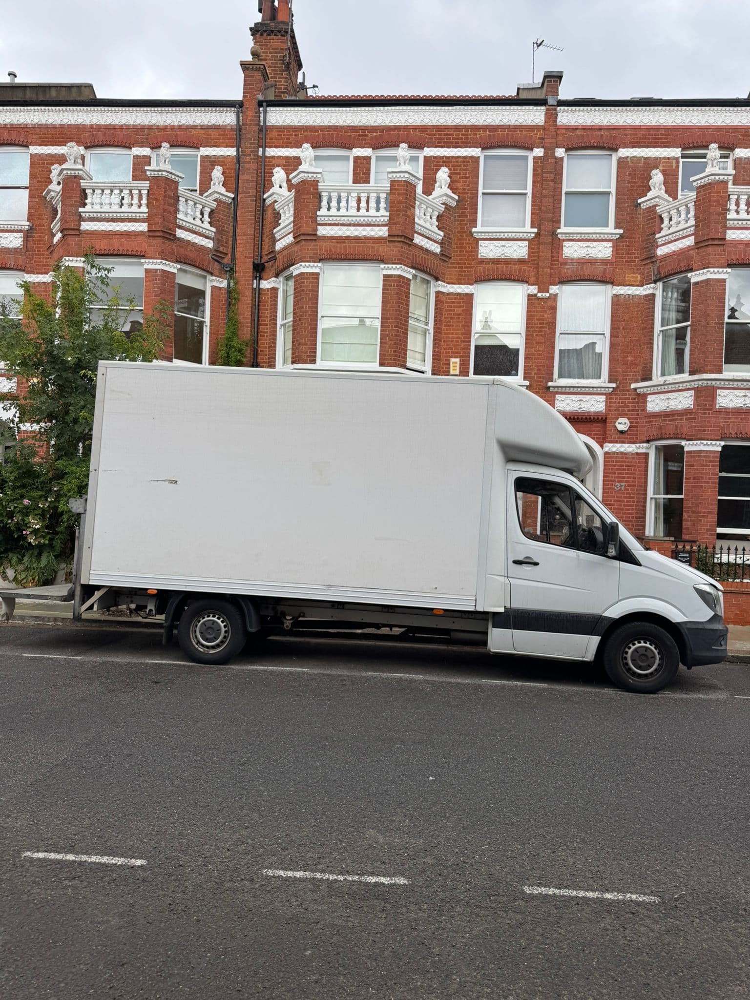 Professional house removal team loading a van in London — Fair Price Movers