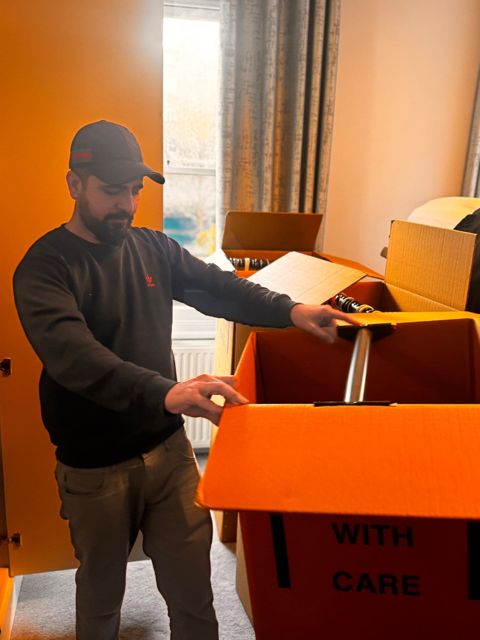 Packing boxes for removal in London — double-walled boxes labelled by room for easy unpacking